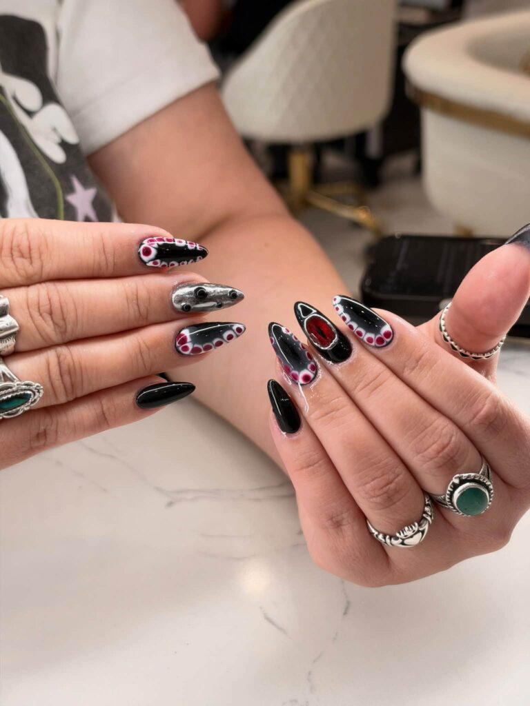 Black and pink nails with sparkling outline accents photographed at Jimmy Nails & Spa.