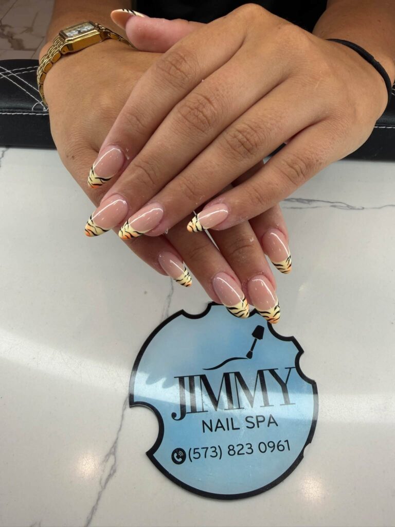Gold-tipped almond nails photographed at Jimmy Nails & Spa in Columbia.