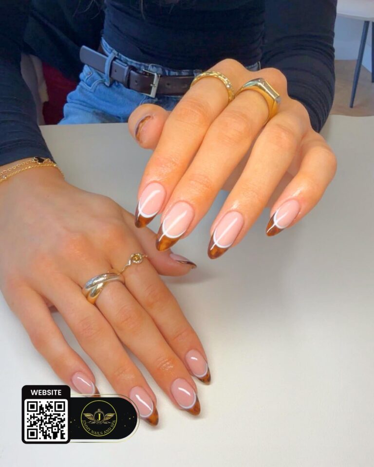 Nude almond nails with white outline tips by Jimmy Nails & Spa.