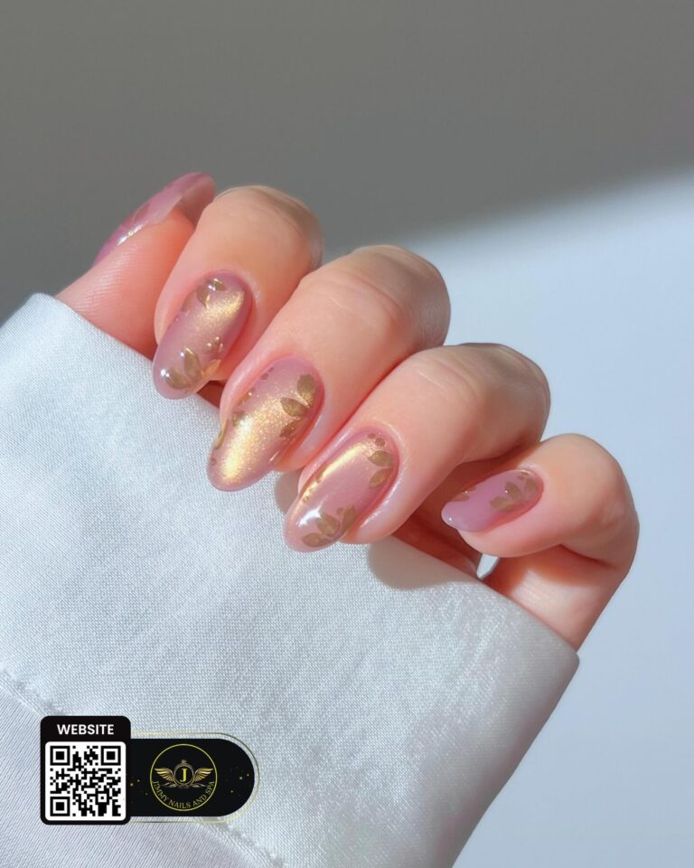 Gold shimmer and soft pink nail design by Jimmy Nails & Spa.